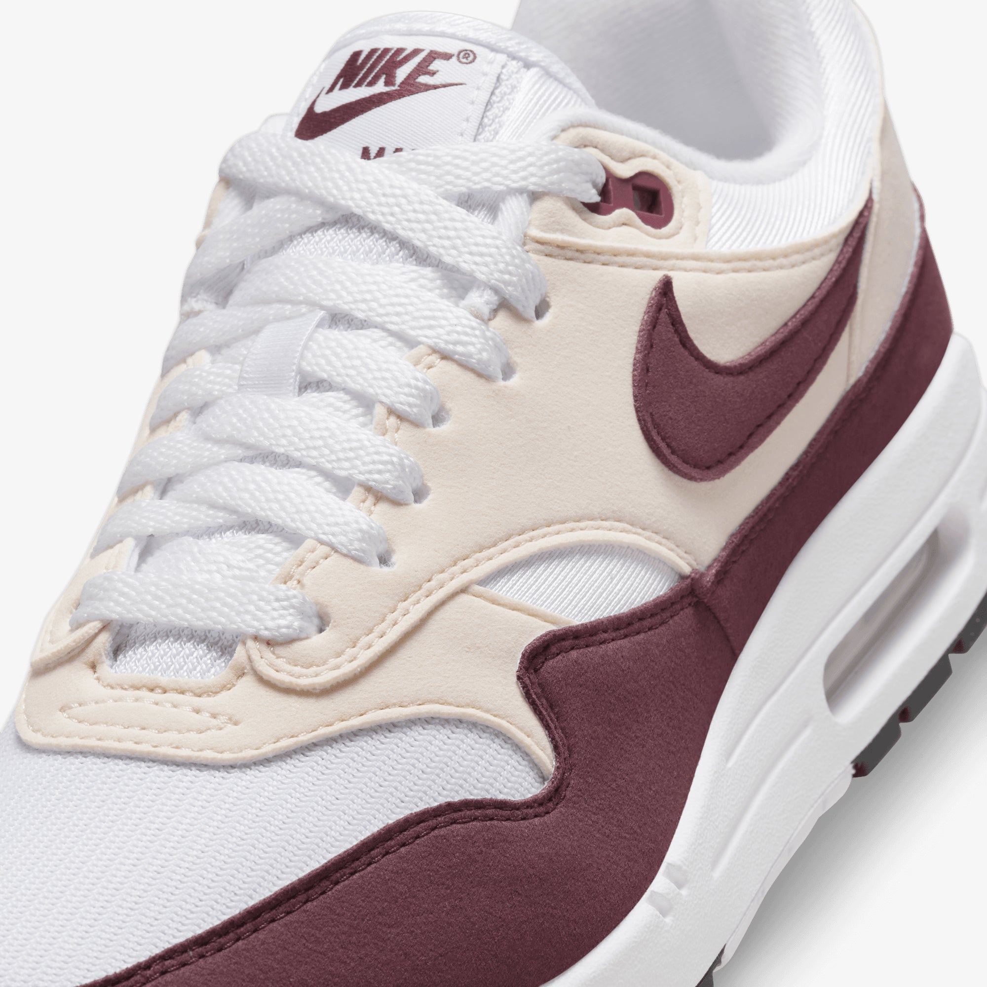 white and maroon nike shoes