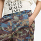 Puma | CLRT ALL-OVER PRINT RIPSTOP PANTS { RAISIN