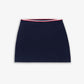 SPORTY & RICH | SERIF LOGO MINI CABLE SKIRT { NAVY