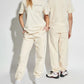 SPORTY & RICH | NY HEALTH CLUB T-SHIRT { CREAM