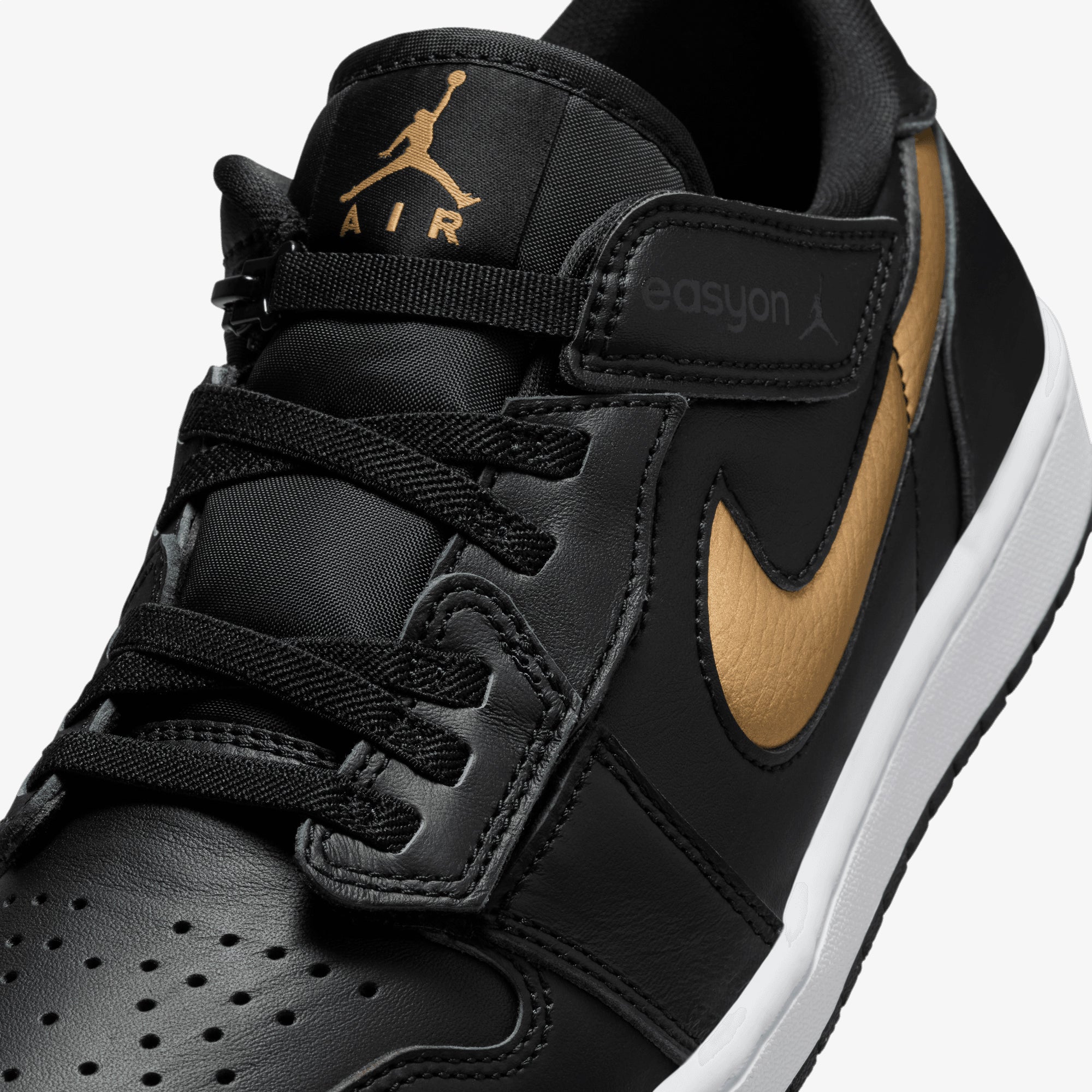 black and gold jordan 1 low