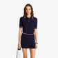 SPORTY & RICH | SERIF LOGO MINI CABLE SKIRT { NAVY