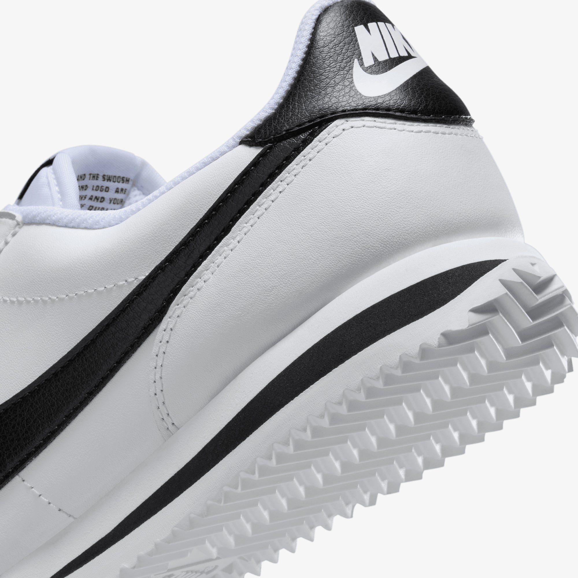 white and black nike cortez shoes