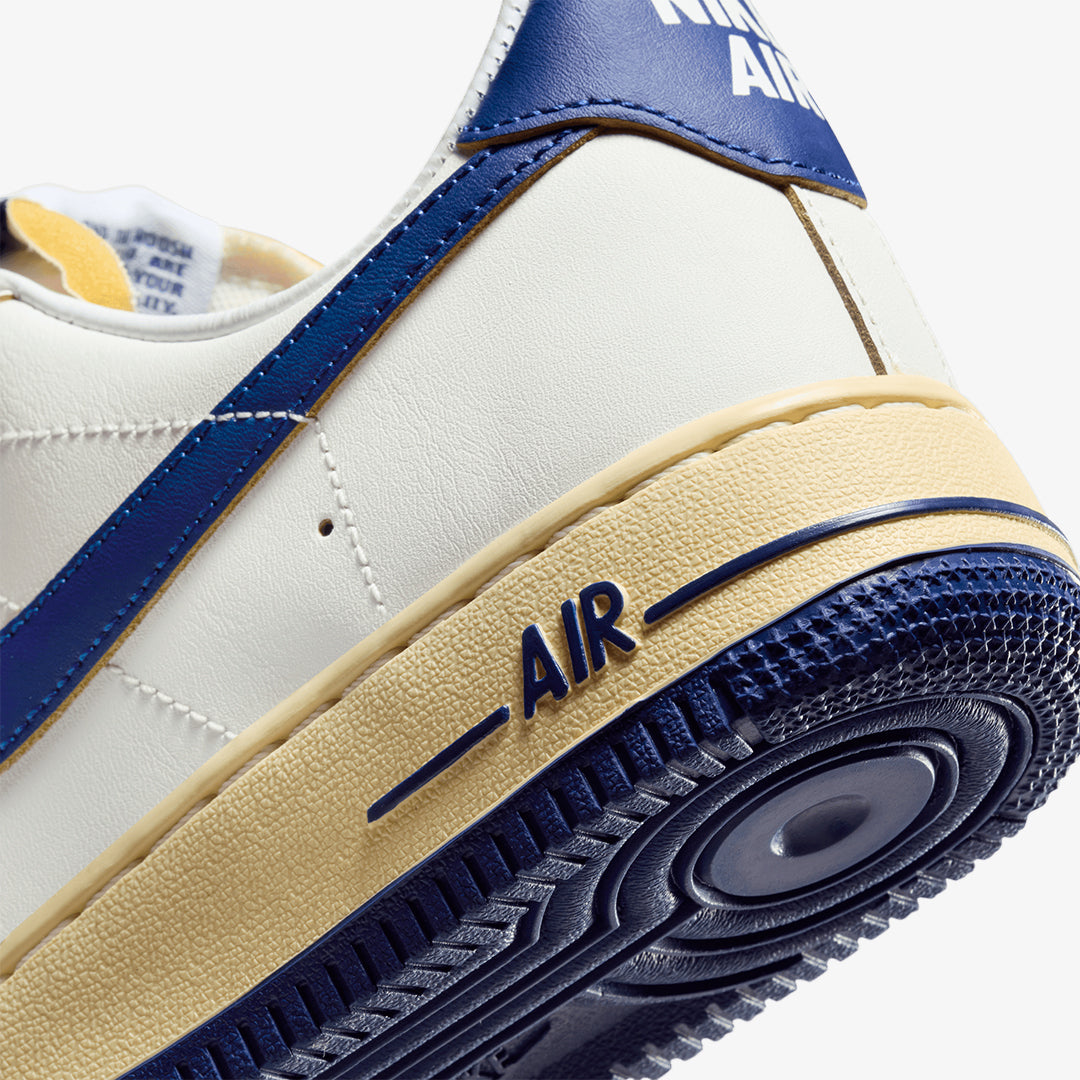 blue nike shoes with gold swoosh