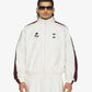 ADIDAS ORIGINALS | x CHAVARRIA WOVEN TRACK JACKET { OFF WHITE