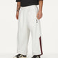Adidas Originals | x CHAVARRIA WOVEN TRACK PANT { OFF WHITE