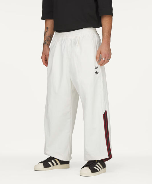 Adidas Originals | x CHAVARRIA WOVEN TRACK PANT { OFF WHITE